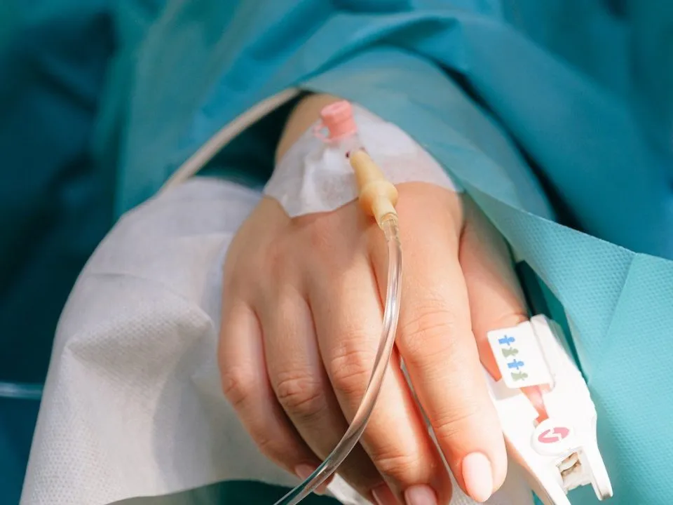 A patient with an IV in. (Pexels/Anna Shvet)