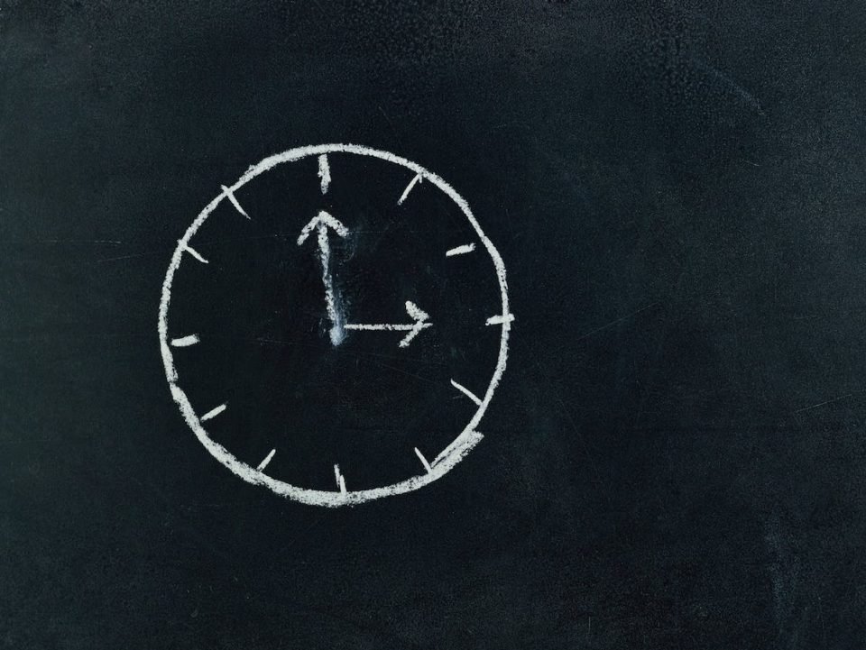 A chalk drawing of a clock.