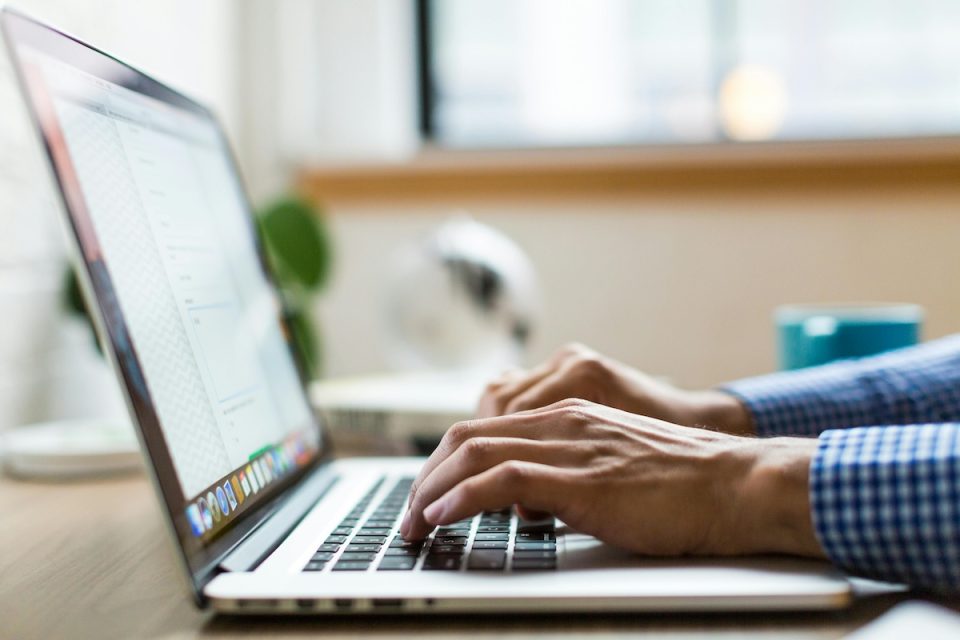 Someon etyping on a laptop. (Pexels/Burst)