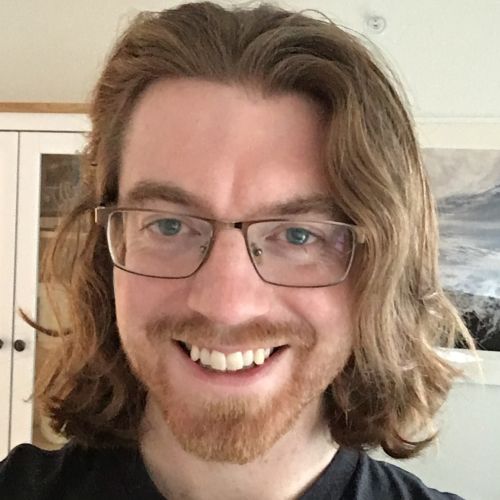 Photo of Author Ewan Horne Green smiling.